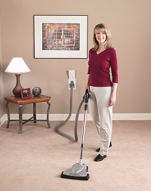 woman using a central vacuum system